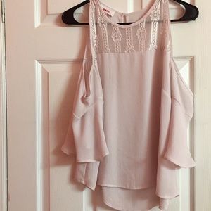 A cute light pink shirt.
